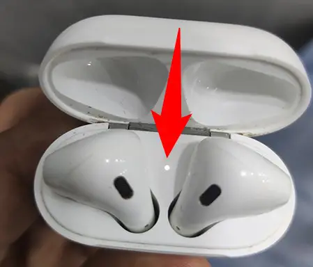 AirPods' light flashing white.