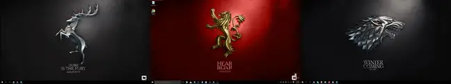 Game of Thrones themed backgrounds randomly arranged on three desktops. 