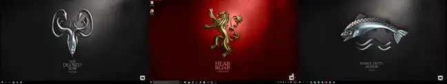 The Game of Thrones backgrounds arranged deliberately on a triple monitor setup. 